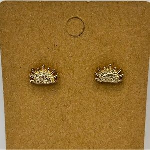 Gold colored sun setting stud earrings